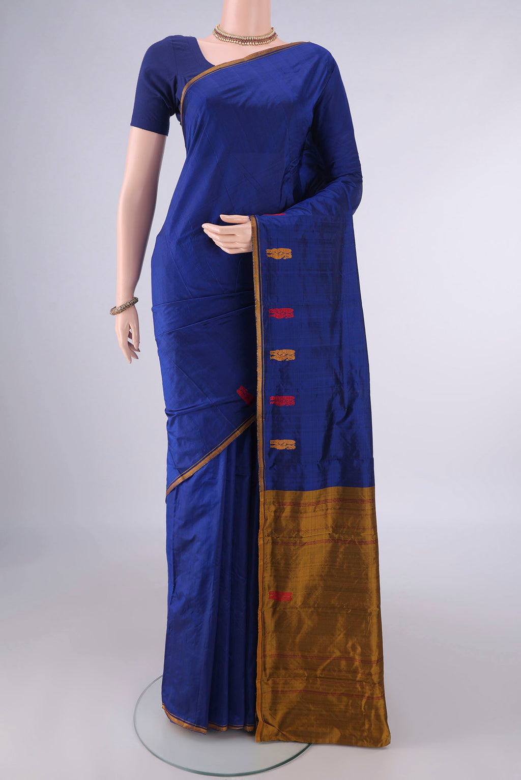 Pure Silk Blue Kanchipuram Saree with Plain Body and Zari And Thread Border.  displayed on a mannequin