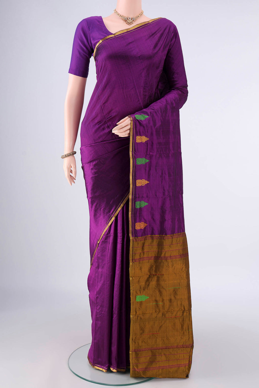Pure Silk Purple Kanchipuram Saree with Plain Body and Zari And Thread Border.  displayed on a mannequin