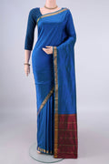 Pure Silk Peacock Blue Kanchipuram Saree with Plain Body and Zari Border.  displayed on a mannequin