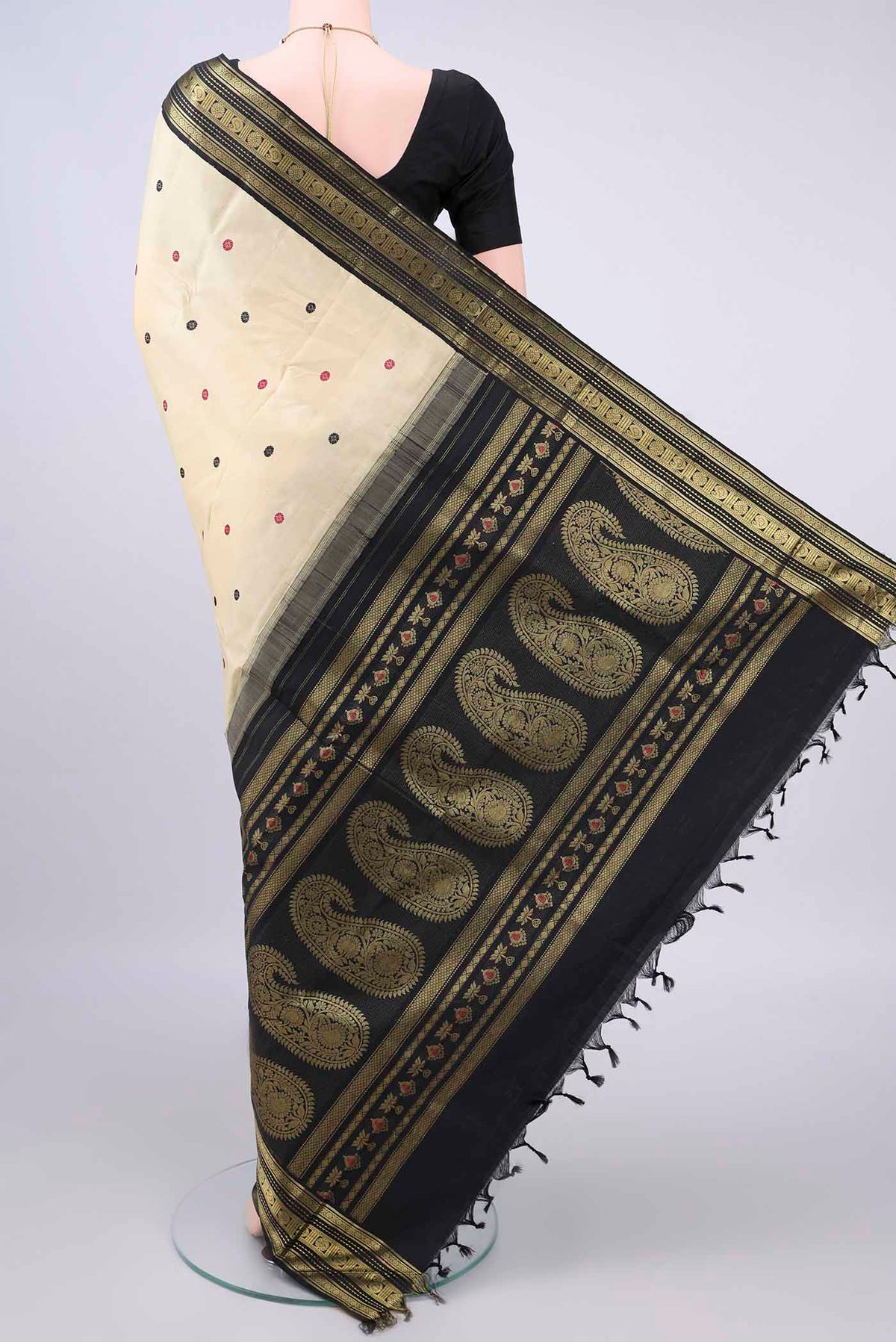 Flat view of Pure Silk Cream Kanjivaram Saree with Thread Butta on the body and Zari Border. 
