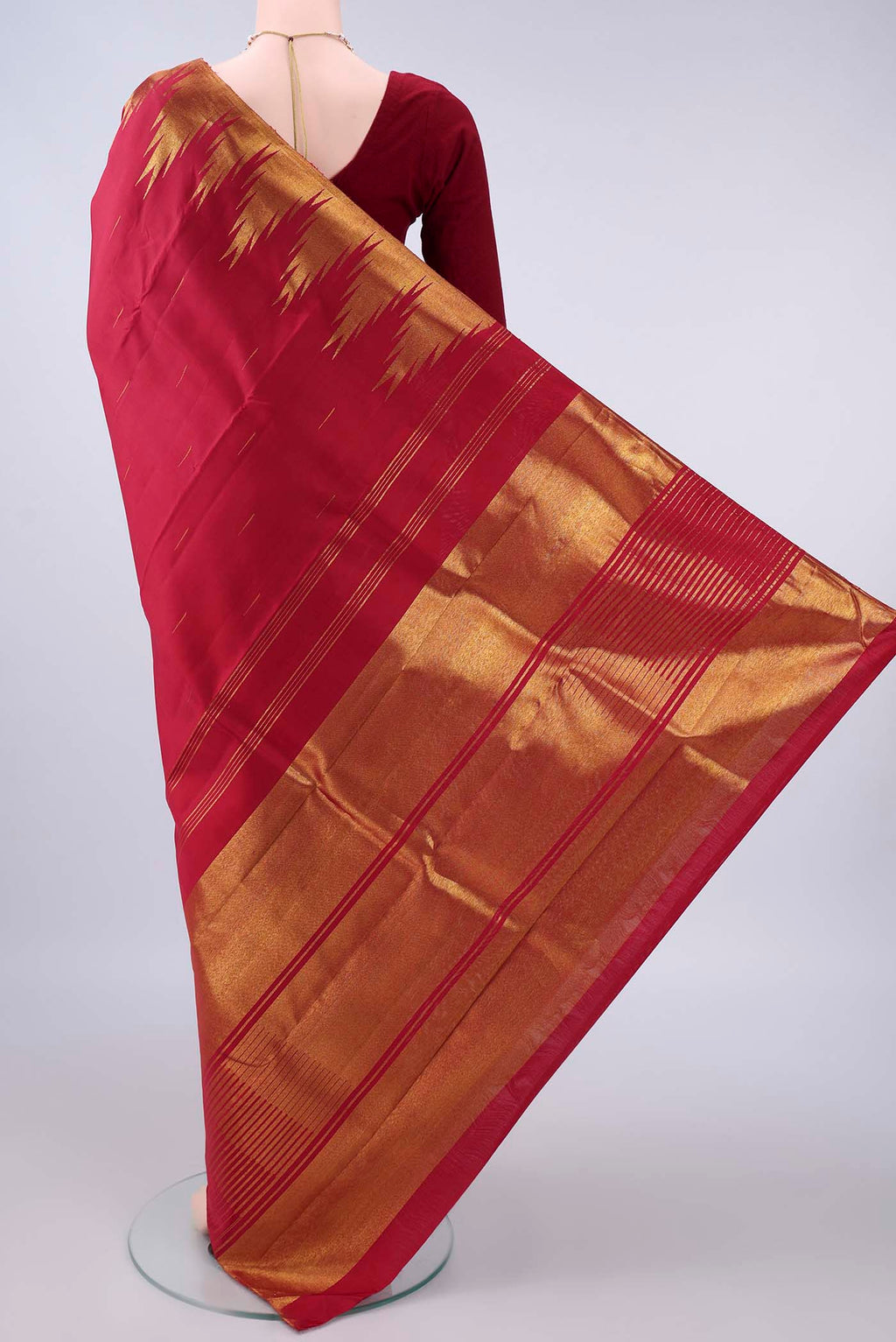 Flat view of Pure Silk Red Kanjivaram Saree with Plain Body and Temple Border. 