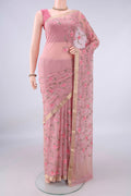 Peach Mysore Chiffon Saree with Embroidery on the body and Zari Border.  displayed on a mannequin