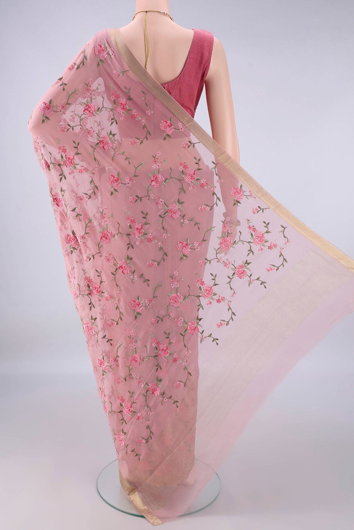 Flat view of Peach Mysore Chiffon Saree with Embroidery on the body and Zari Border. 