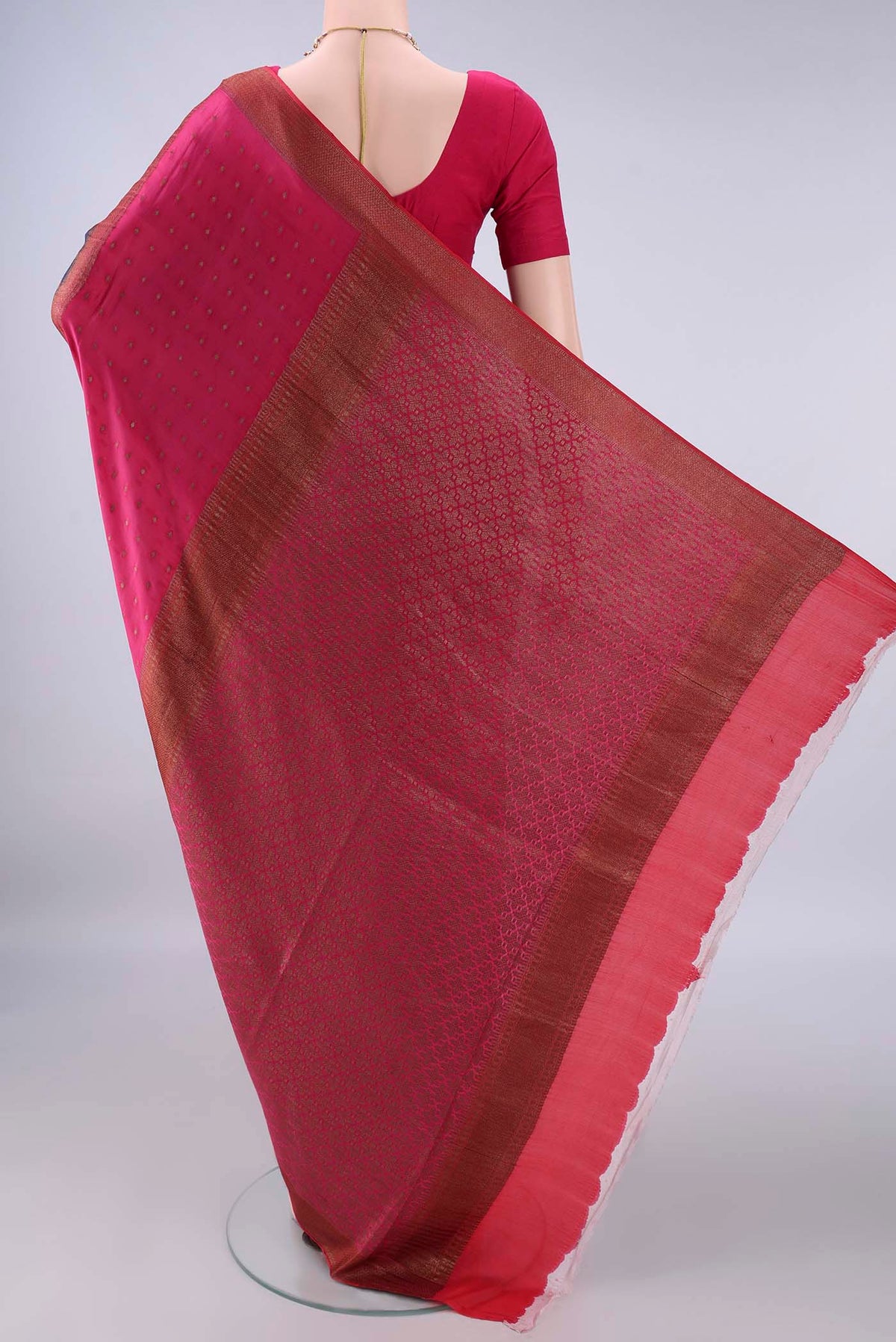 Flat view of Navy Blue Mysore Crepe Saree with Zari Butta on the body and Zari Border. 