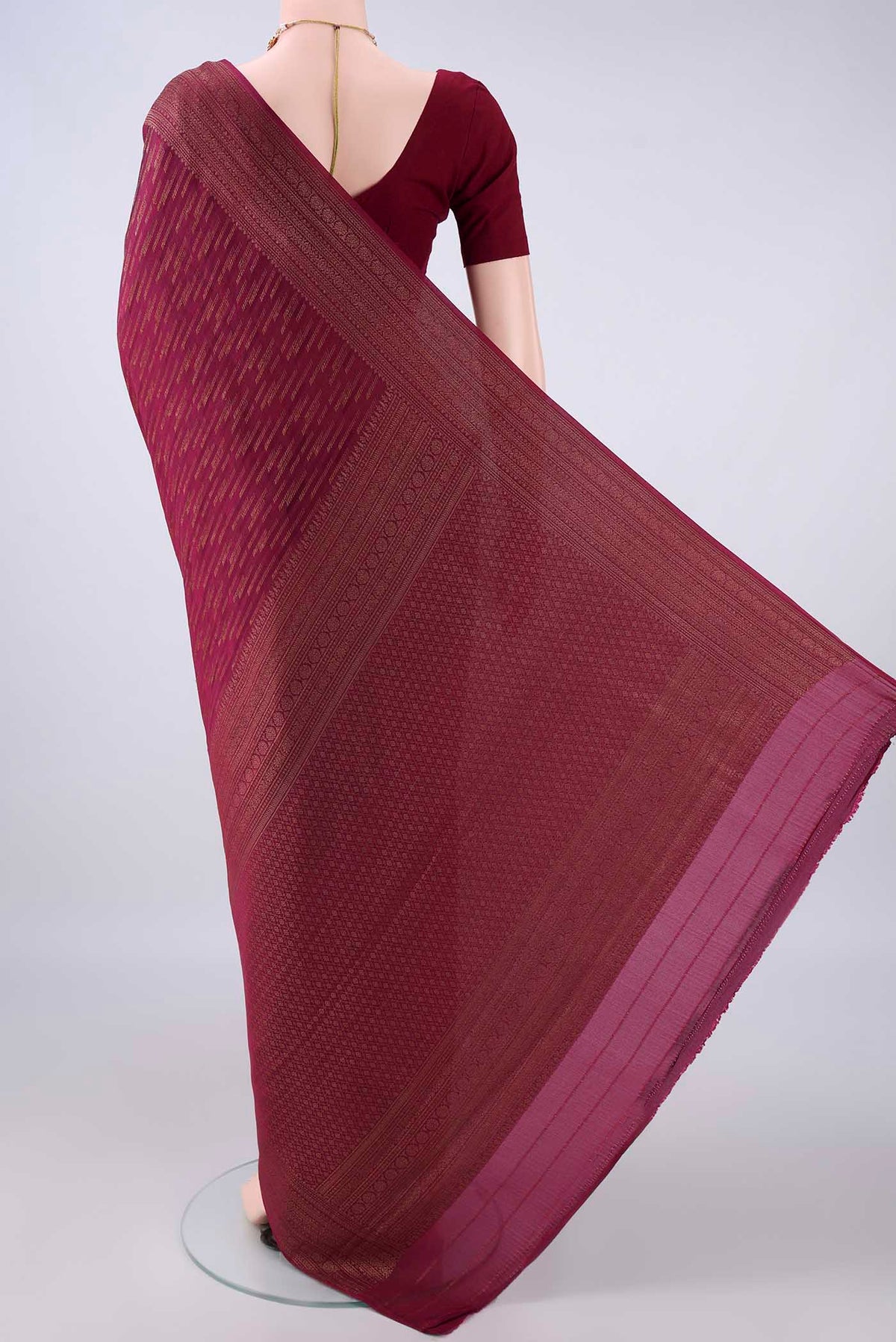 Flat view of Maroon Mysore Crepe Saree with Zari Brocade on the body and Zari Border. 