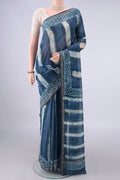 Blue Grey Chanderi Cotton Saree with Batik Print on the body and Thin Zari Line.  displayed on a mannequin