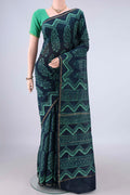 Indigo Chanderi Cotton Saree with Batik Print on the body and Thin Zari Line.  displayed on a mannequin