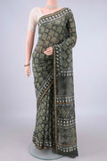 Mehandi Green Chanderi Cotton Saree with Batik Print on the body and Thin Zari Line.  displayed on a mannequin