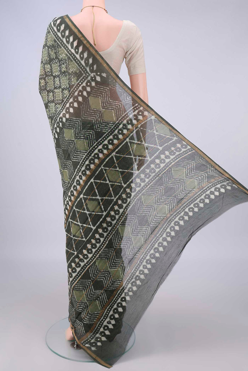 Flat view of Mehandi Green Chanderi Cotton Saree with Batik Print on the body and Thin Zari Line. 