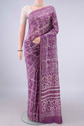 Purple Chanderi Cotton Saree with Batik Print on the body and Thin Zari Line.  displayed on a mannequin