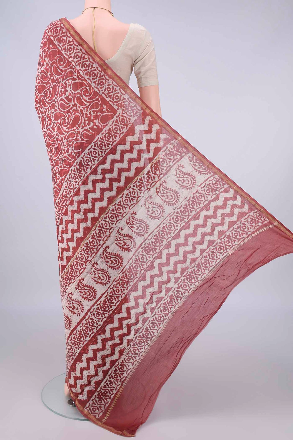 Flat view of Peach Chanderi Cotton Saree with Batik Print on the body and Thin Zari Line. 