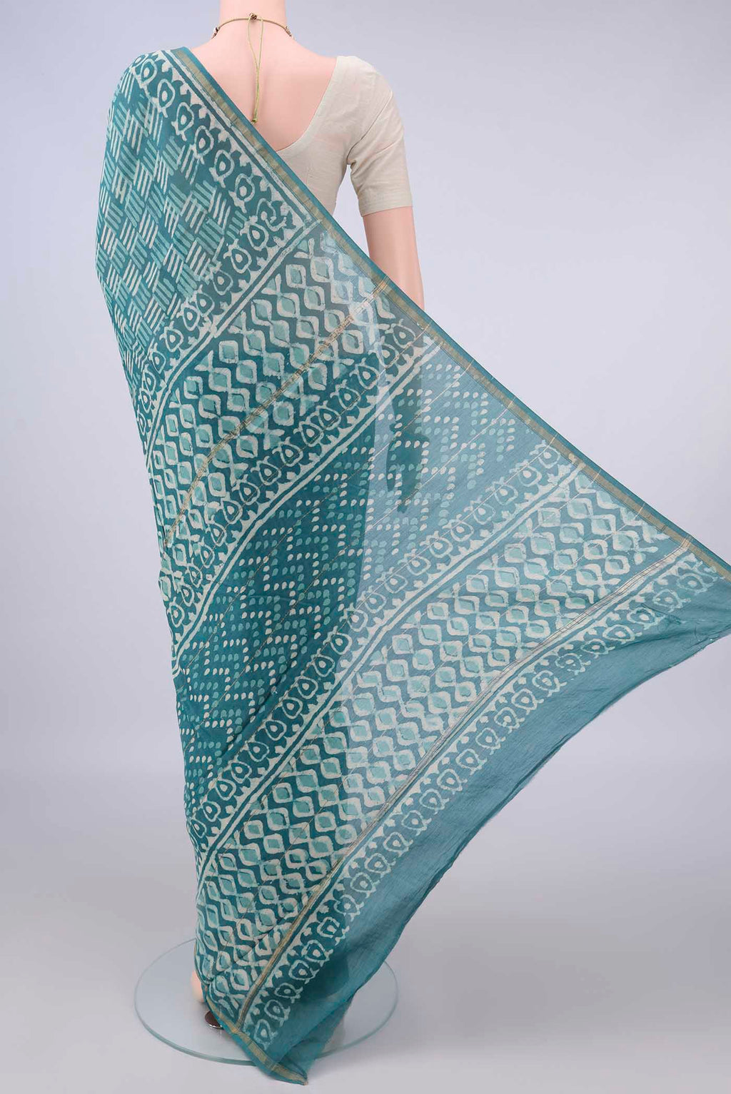 Flat view of Blue Chanderi Cotton Saree with Batik Print on the body and Thin Zari Line. 