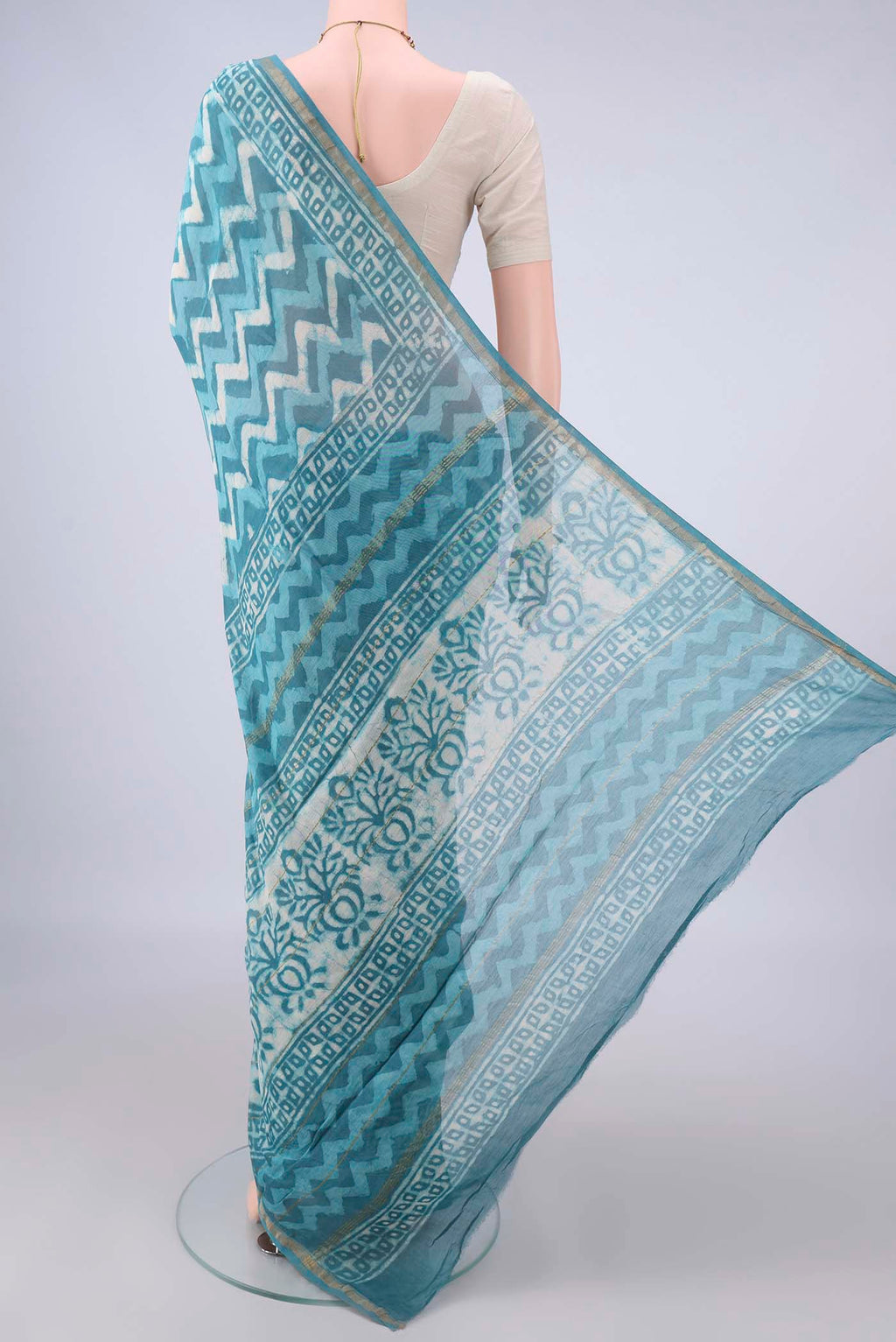 Flat view of Blue Chanderi Cotton Saree with Batik Print on the body and Thin Zari Line. 