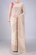 Pure Silk Off White Banarasi Saree with Zari And Thread Butta on the body and Meenakari Border.  displayed on a mannequin