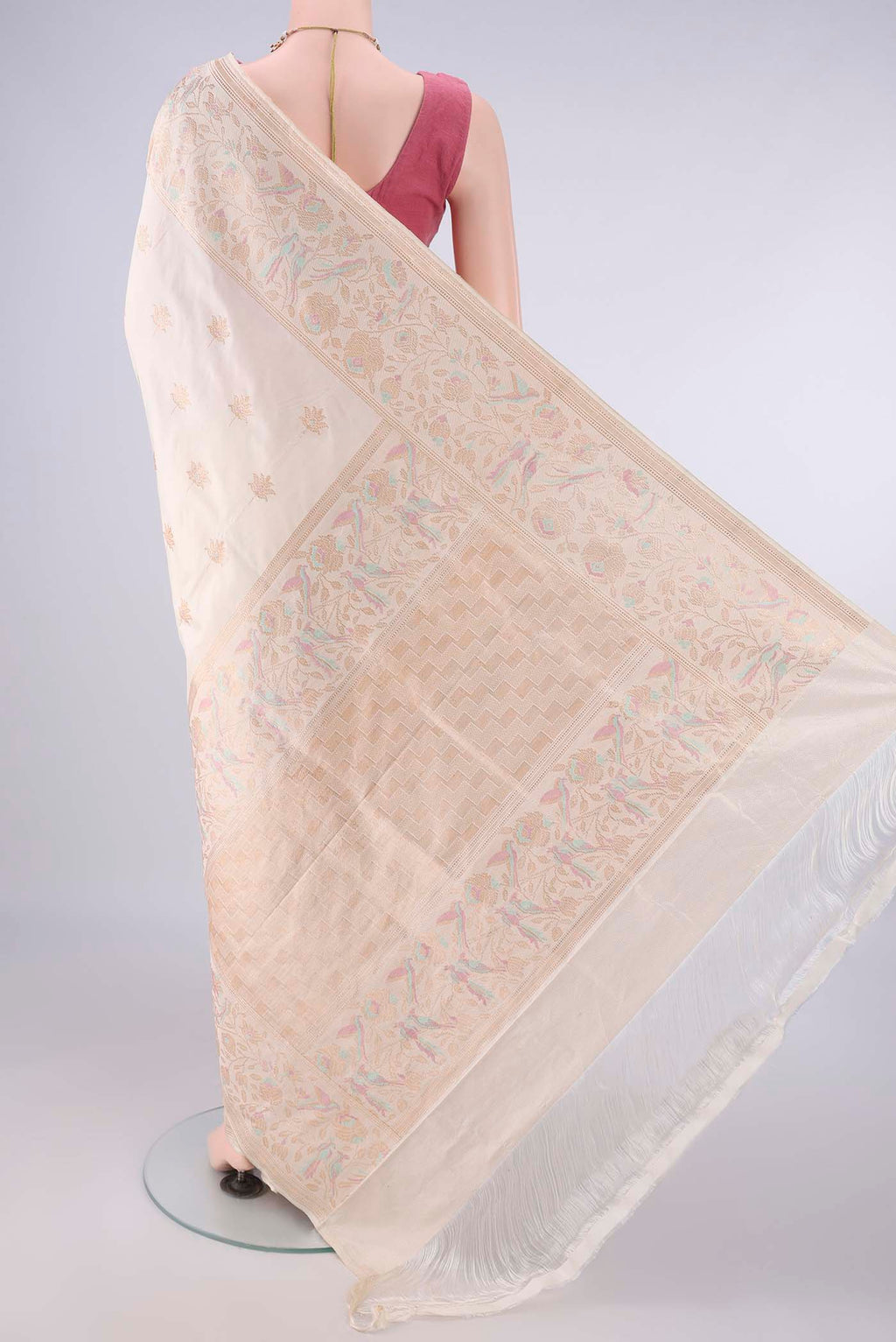Flat view of Pure Silk Off White Banarasi Saree with Zari And Thread Butta on the body and Meenakari Border. 