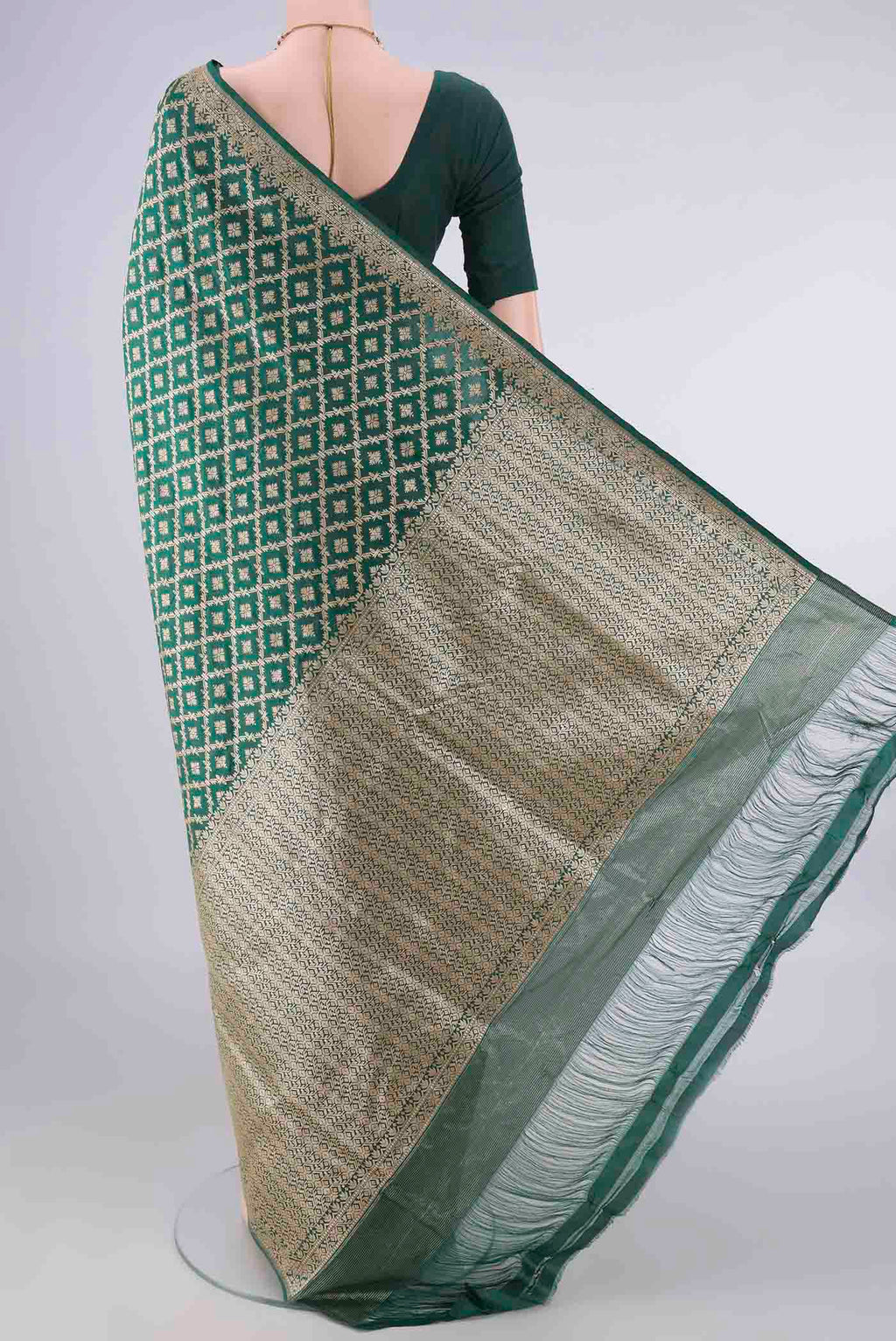 Flat view of Pure Silk Green Banarasi Saree with Zari Brocade on the body and Zari Border. 