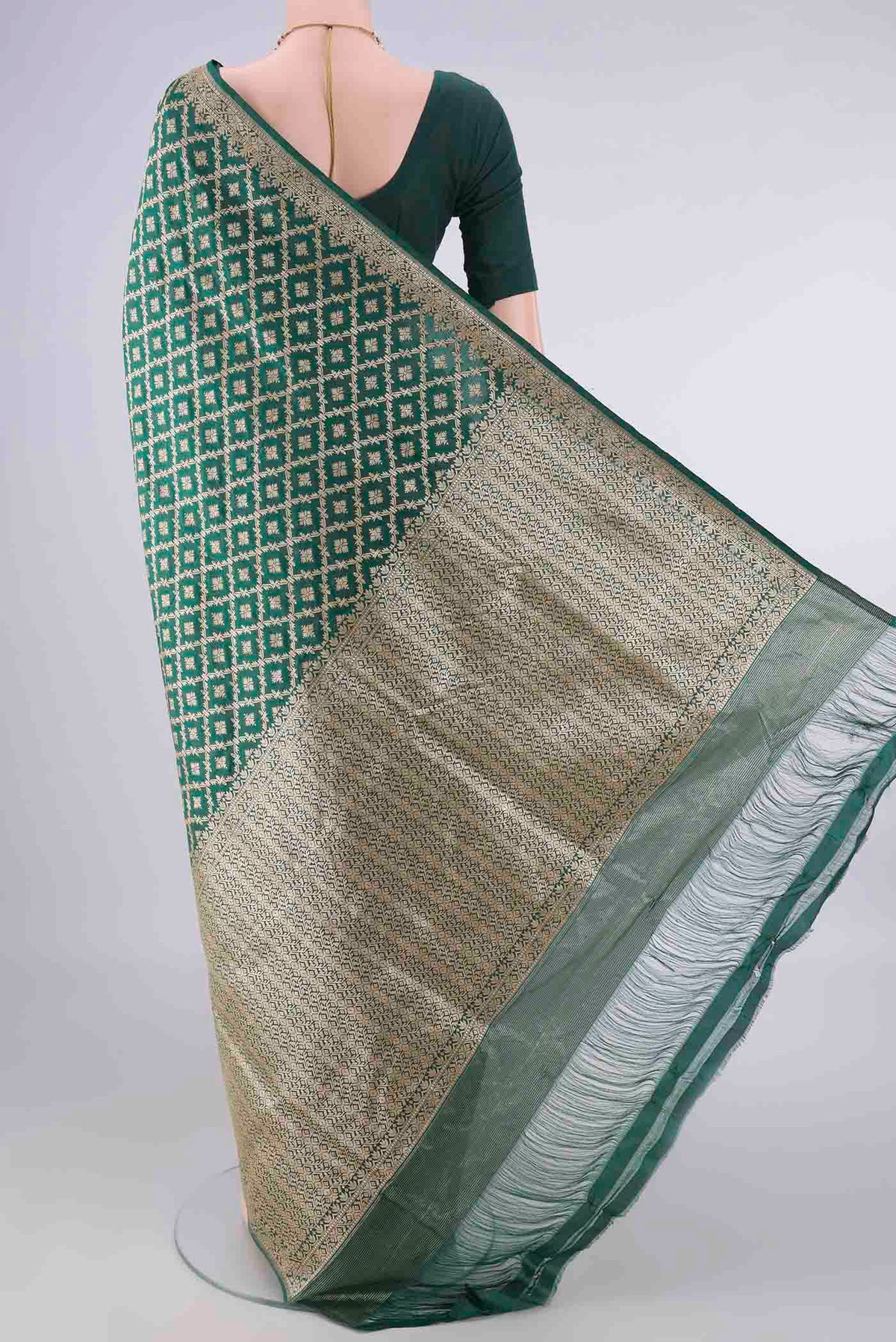 Flat view of Pure Silk Green Banarasi Saree with Zari Brocade on the body and Zari Border. 