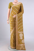 Pure Silk Mustard Banarasi Saree with Zari Butta on the body and Zari And Thread Border.  displayed on a mannequin