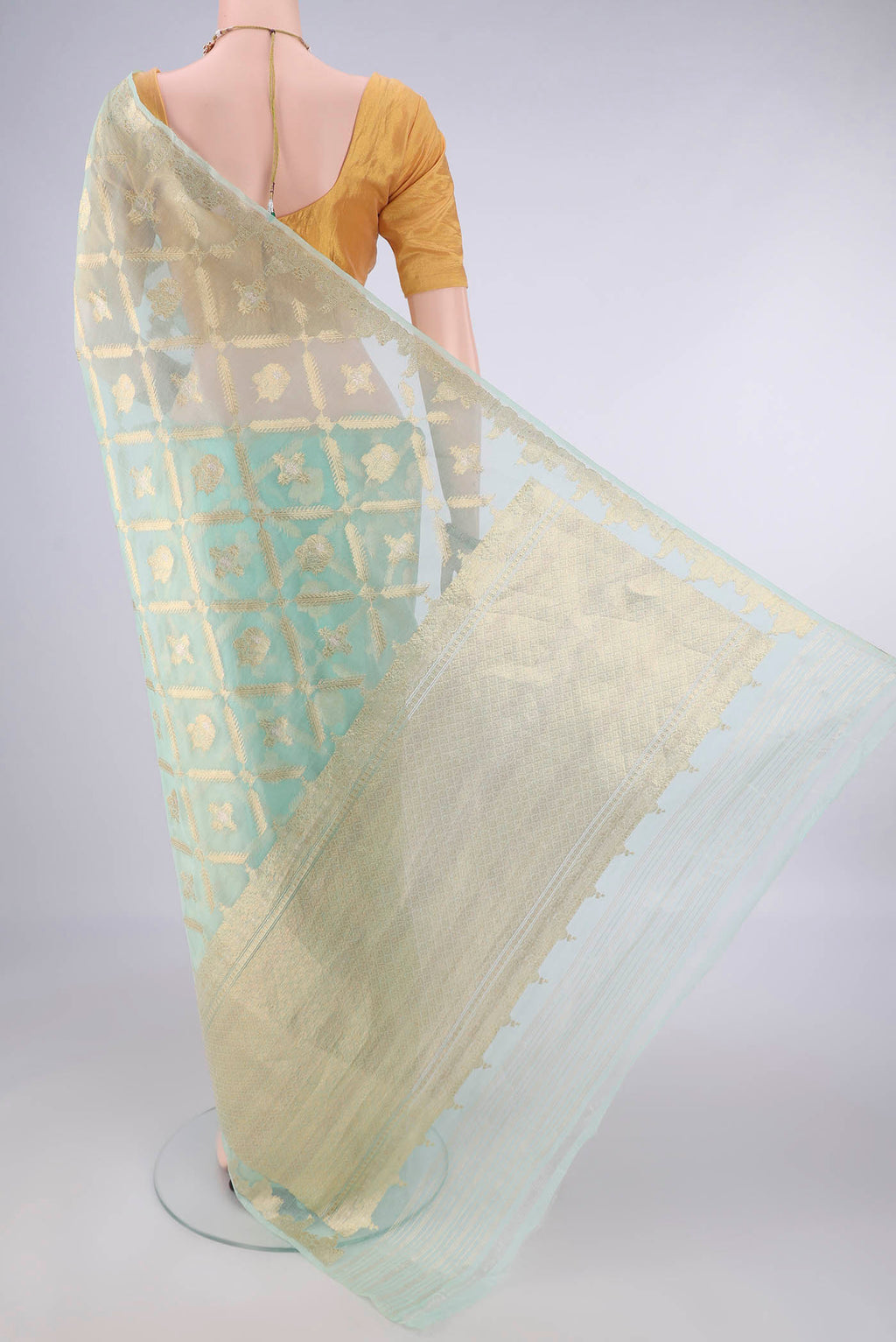 Flat view of Pure Silk Mint Green Banarasi Kora Saree with Zari Brocade on the body and Zari Border. 