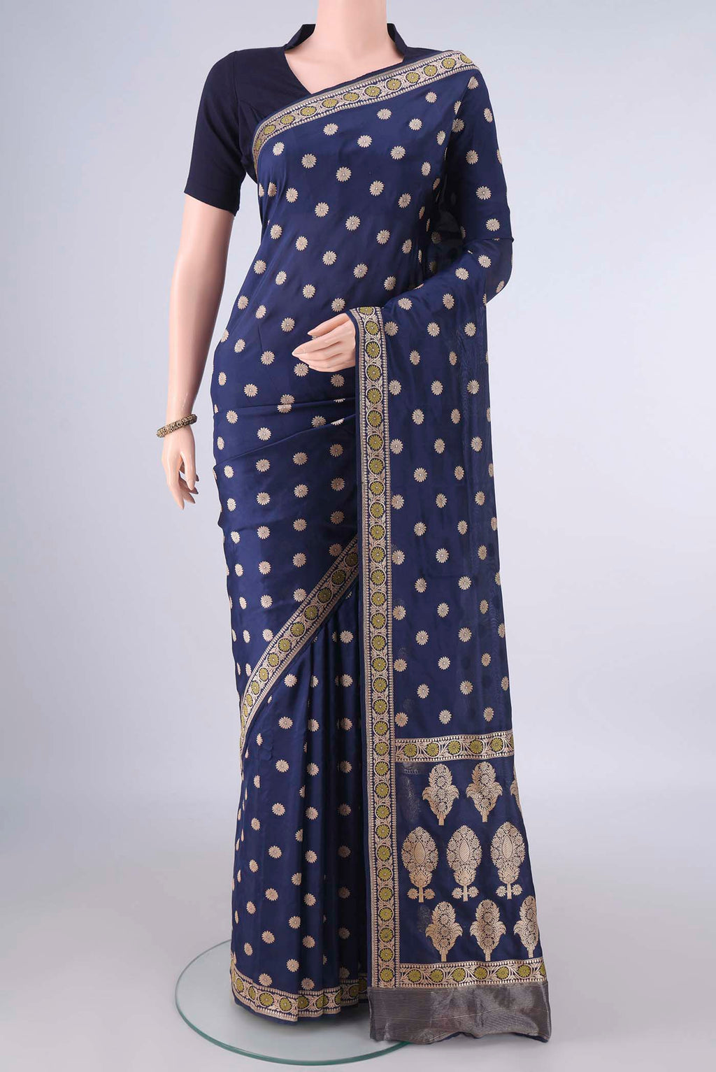 Pure Silk Navy Blue Banarasi Saree with Zari Butta on the body and Zari And Thread Border.  displayed on a mannequin