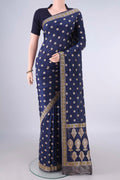 Pure Silk Navy Blue Banarasi Saree with Zari Butta on the body and Zari And Thread Border.  displayed on a mannequin