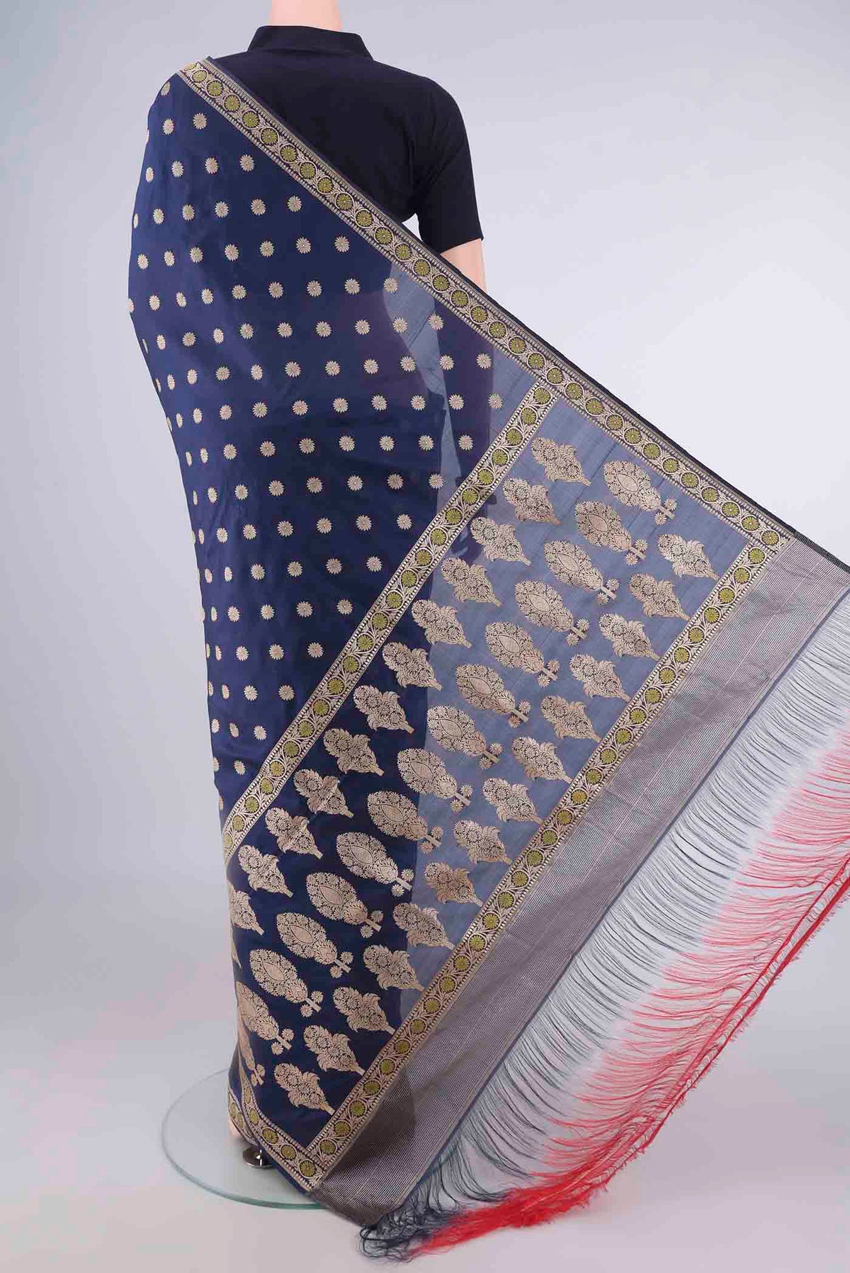 Flat view of Pure Silk Navy Blue Banarasi Saree with Zari Butta on the body and Zari And Thread Border. 