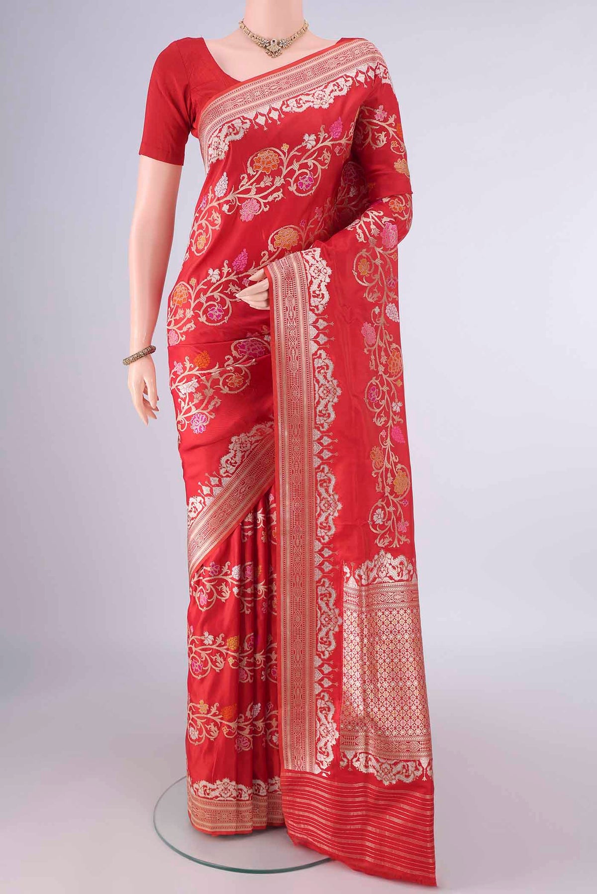 Pure Silk Red Banarasi Saree with Zari Brocade on the body and Zari Border.  displayed on a mannequin