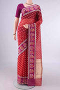 Pure Silk Red Banarasi Kora Saree with Zari And Thread Butta on the body and Zari And Thread Border.  displayed on a mannequin