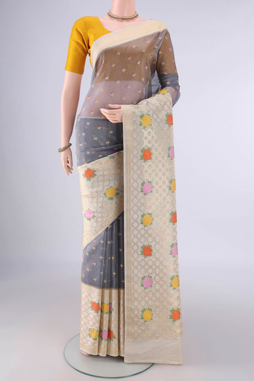 Pure Silk Blue Grey Banarasi Kora Saree with Zari And Thread Butta on the body and Zari And Thread Border.  displayed on a mannequin
