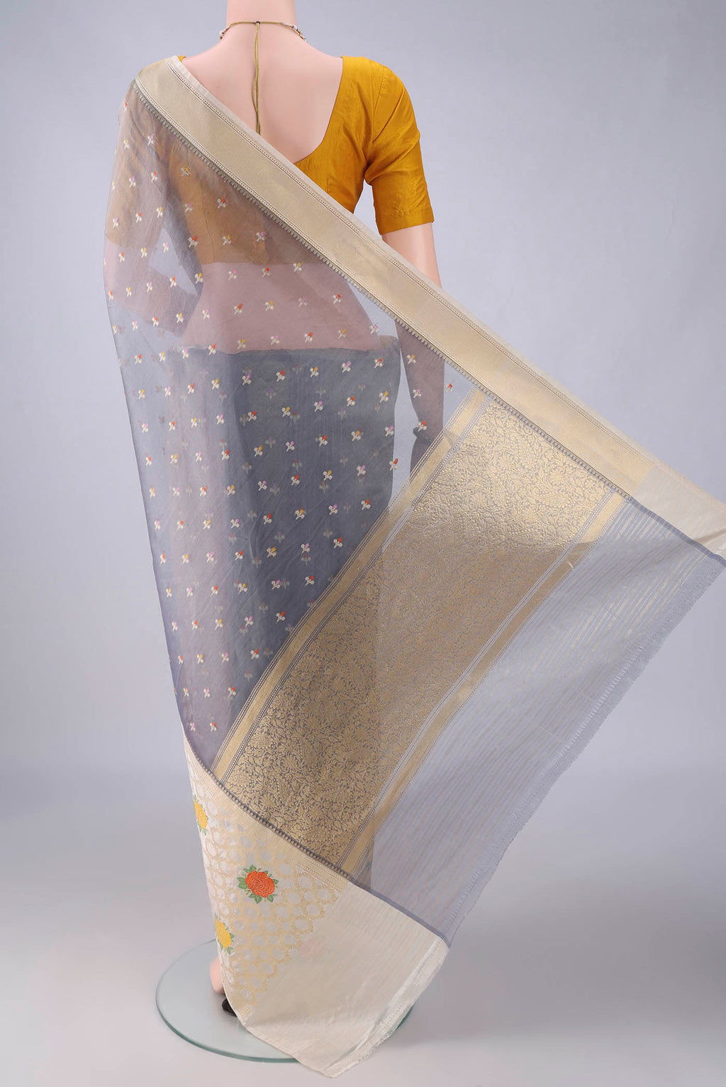 Flat view of Pure Silk Blue Grey Banarasi Kora Saree with Zari And Thread Butta on the body and Zari And Thread Border. 