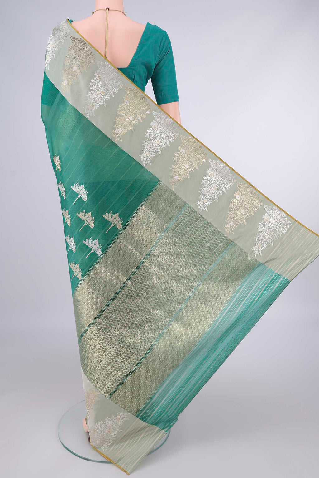 Flat view of Pure Silk Sea Green Banarasi Kora Saree with Zari And Thread Butta on the body and Zari And Thread Border. 
