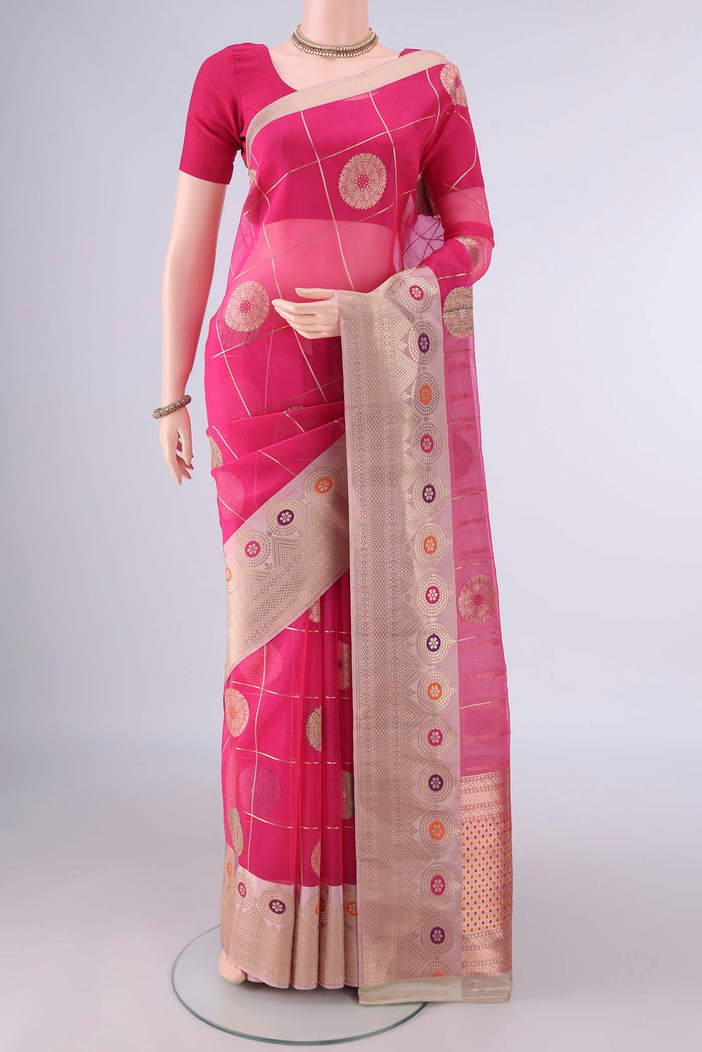 Pure Silk Rani Pink Banarasi Kora Saree with Checked design on the body and Zari And Thread Border.  displayed on a mannequin