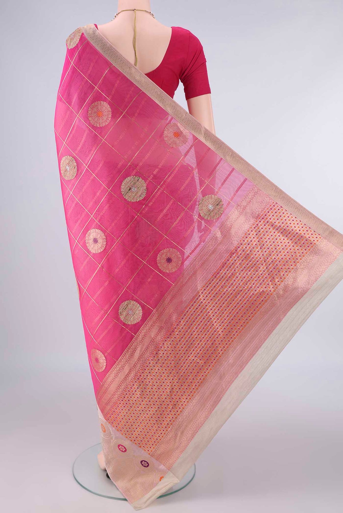 Flat view of Pure Silk Rani Pink Banarasi Kora Saree with Checked design on the body and Zari And Thread Border. 