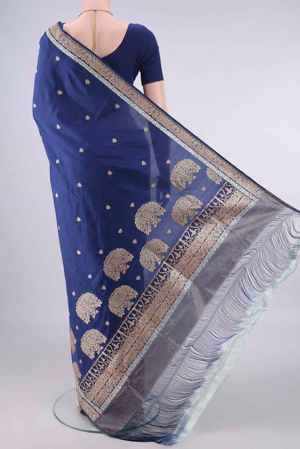 Flat view of Pure Silk Dark Blue Banarasi Saree with Zari Butta on the body and Zari Border. 