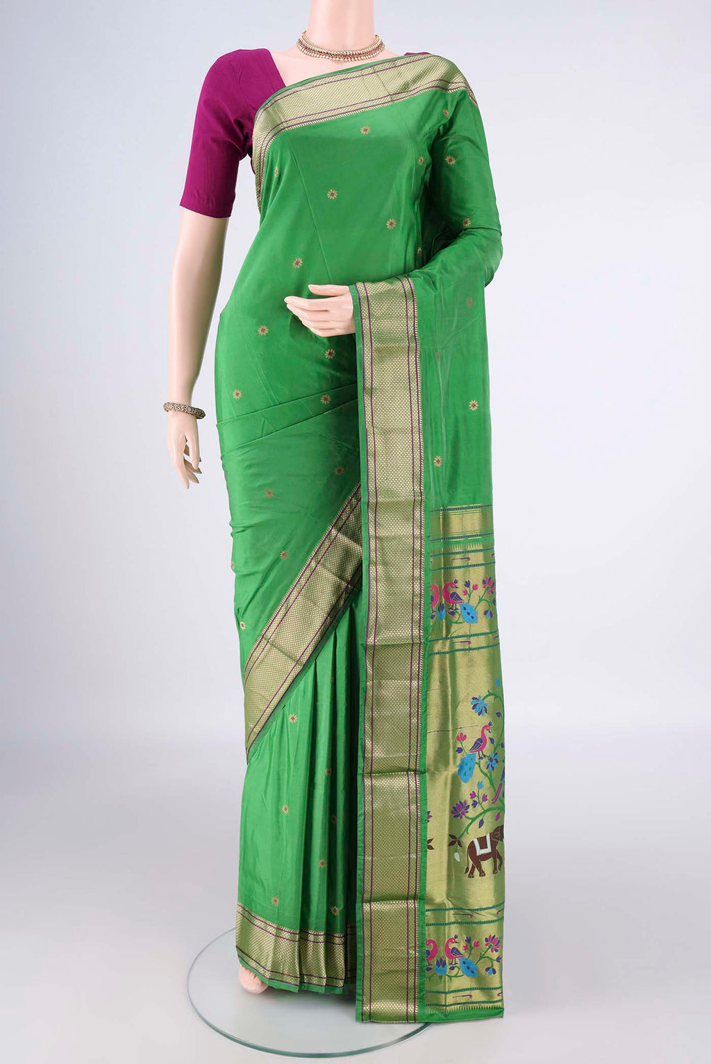 Green Blended Paithani Silk Saree with Zari And Thread Butta on the body and Zari Border.  displayed on a mannequin
