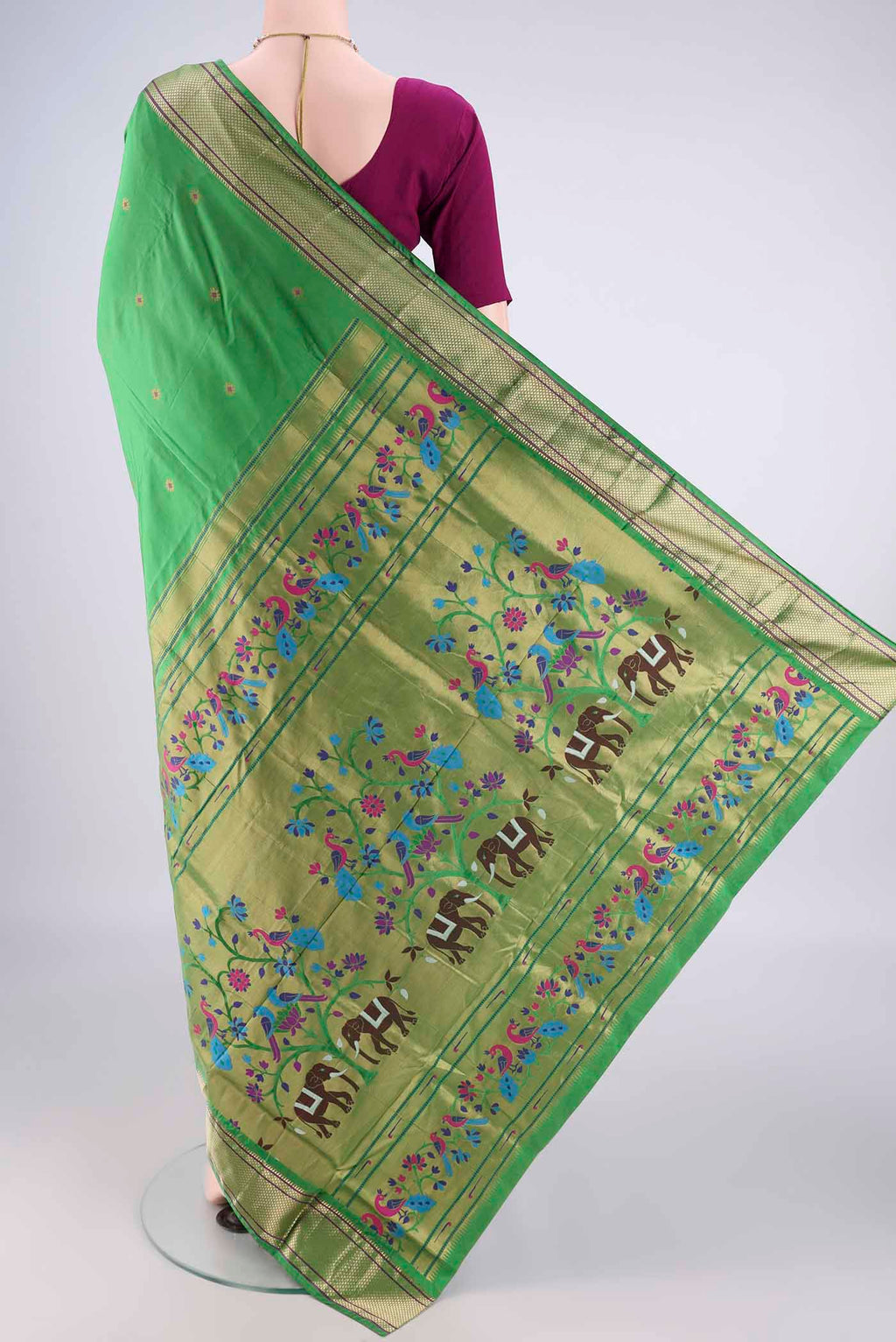 Flat view of Green Blended Paithani Silk Saree with Zari And Thread Butta on the body and Zari Border. 