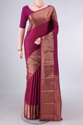Pure Silk Magenta Kanjivaram Saree with Zari Butta on the body and Zari Border.  displayed on a mannequin