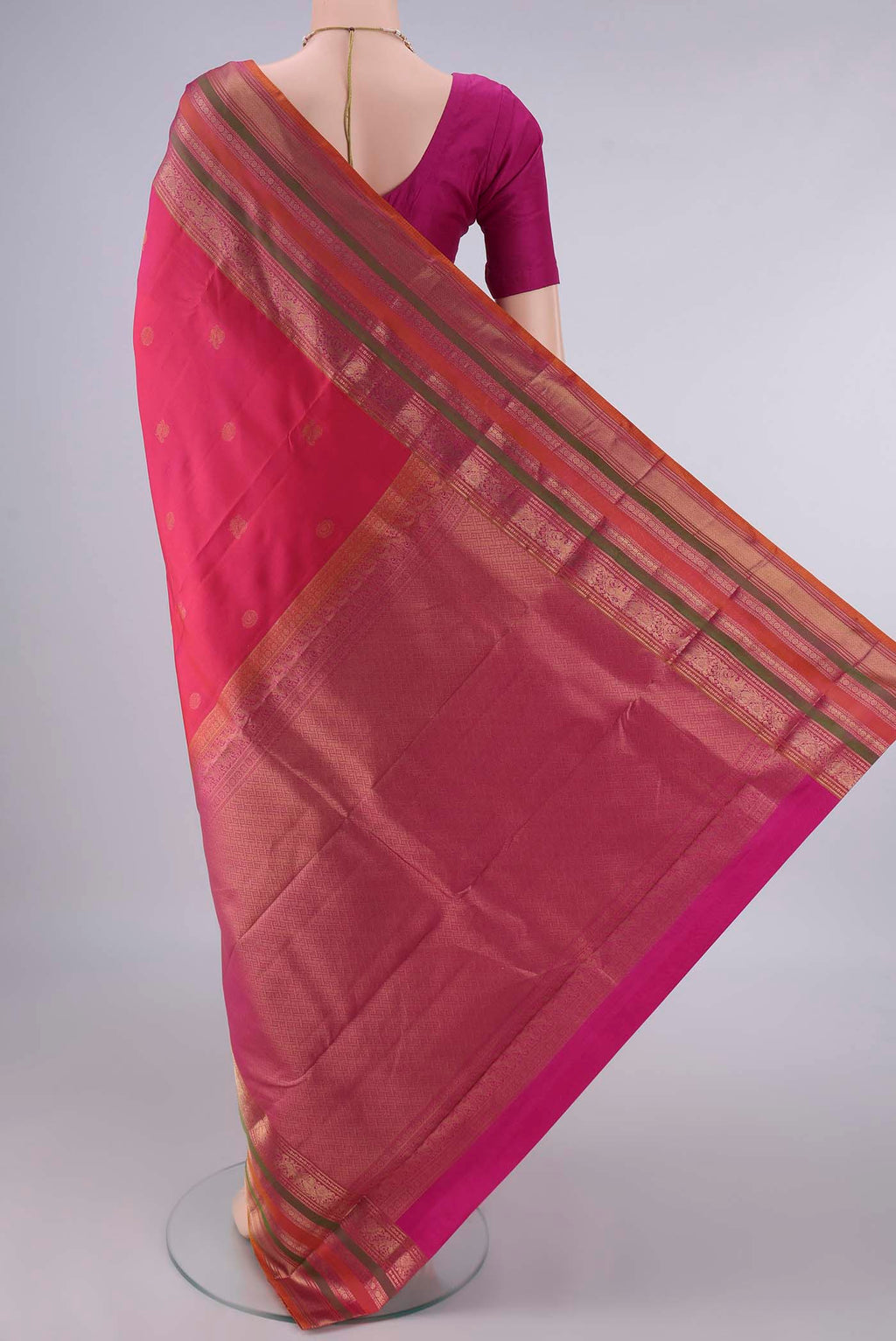 Flat view of Pure Silk Coral Kanjivaram Saree with Zari Butta on the body and Zari Border. 