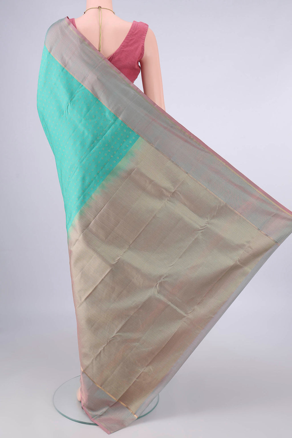 Flat view of Pure Silk Turquoise Kanchipuram Saree with Zari Butta on the body and Zari Border. 