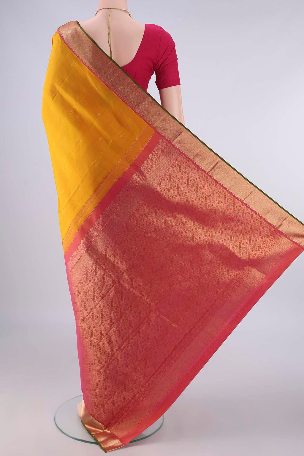Flat view of Pure Silk Mustard Kanjivaram Saree with Zari Butta on the body and Zari Border. 