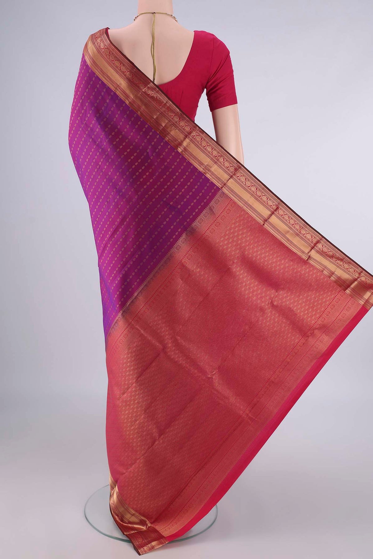 Flat view of Pure Silk Purple Kanchipuram Saree with Zari Butta on the body and Zari Border. 