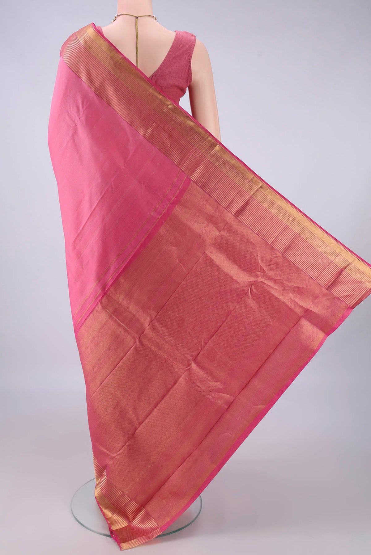 Flat view of Pure Silk Coral Kanchipuram Saree with Zari Butta on the body and Zari Border. 
