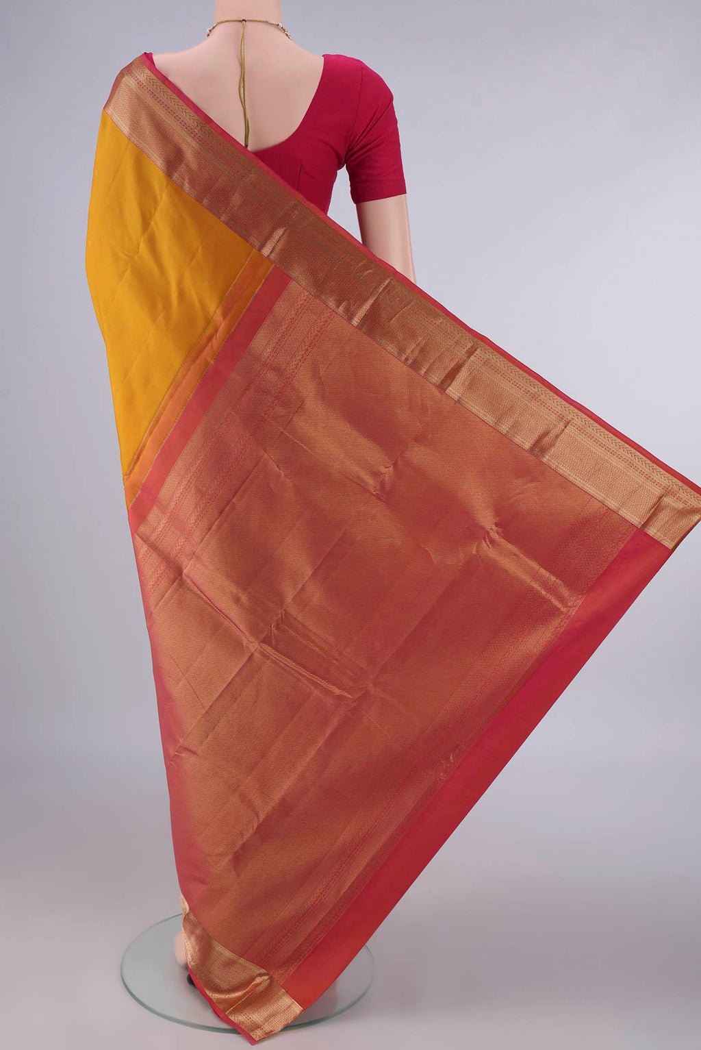 Flat view of Pure Silk Mustard Kanchipuram Saree with Zari Butta on the body and Zari Border. 