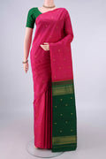 Pure Silk Rani Pink Kanchipuram Saree with Zari And Thread Butta on the body and Without Border.  displayed on a mannequin