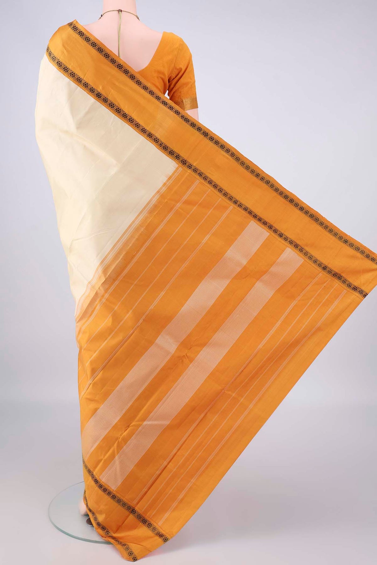Flat view of Pure Silk Off White Kanjivaram Saree with Plain Body and Thread Border. 