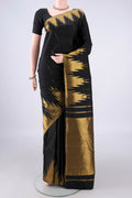 Pure Silk Black Kanjivaram Saree with Zari Butta on the body and Temple Border.  displayed on a mannequin