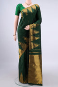 Pure Silk Bottle Green Kanjivaram Saree with Zari Butta on the body and Temple Border.  displayed on a mannequin
