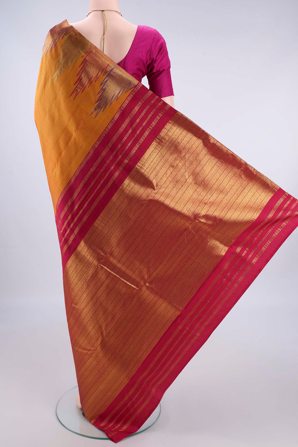 Flat view of Pure Silk Mustard Kanjivaram Saree with Plain Body and Temple Border. 
