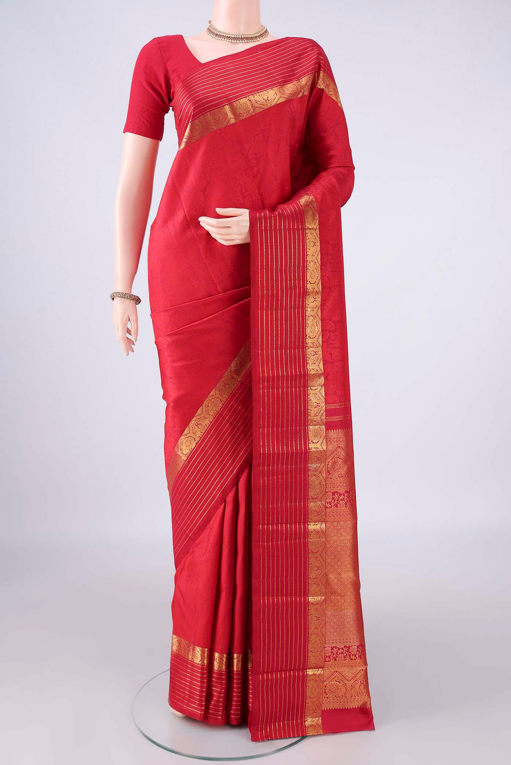 Pure Silk Deep Red Kanjivaram Saree with Jacquard design on the body and Zari Border.  displayed on a mannequin