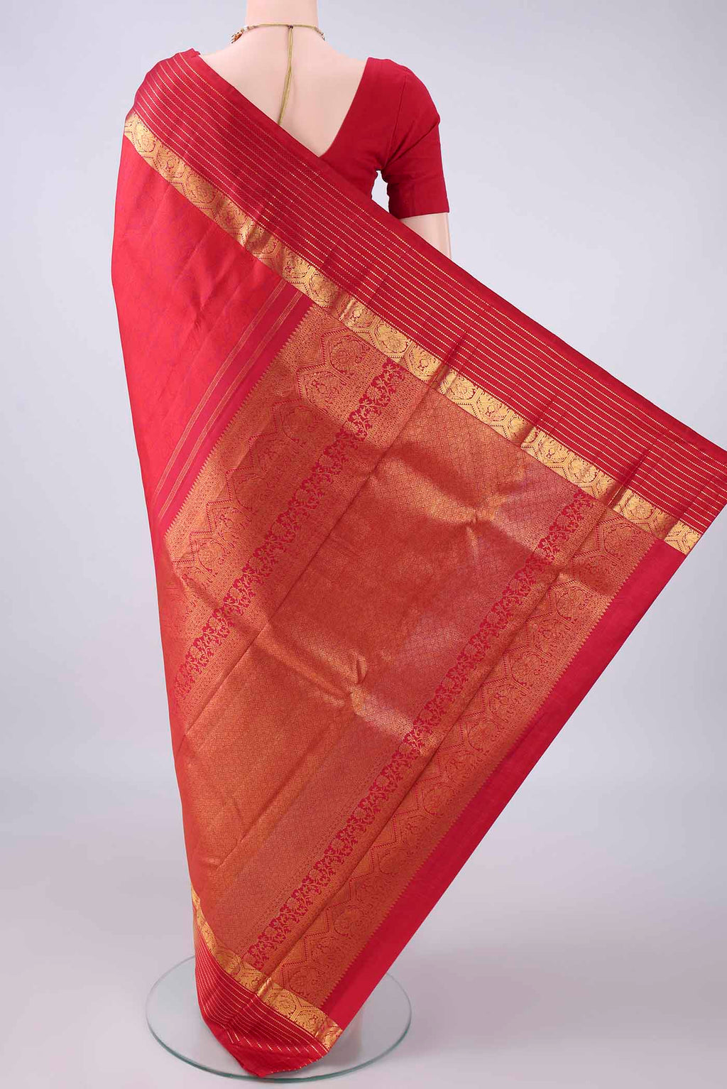 Flat view of Pure Silk Deep Red Kanjivaram Saree with Jacquard design on the body and Zari Border. 